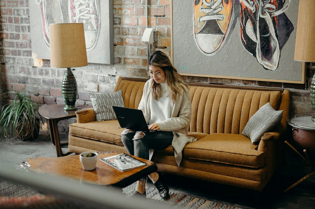 person working on laptop at home