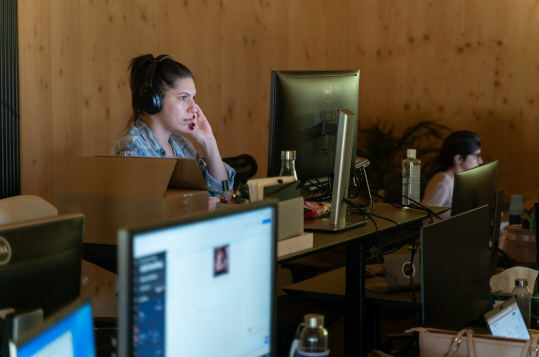 woman coding at desk