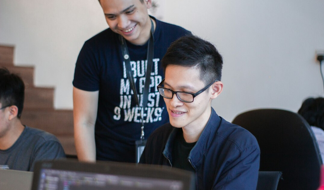 diverse students learning coding